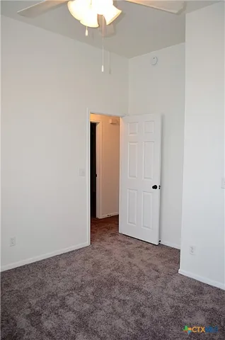 an empty room with closet area
