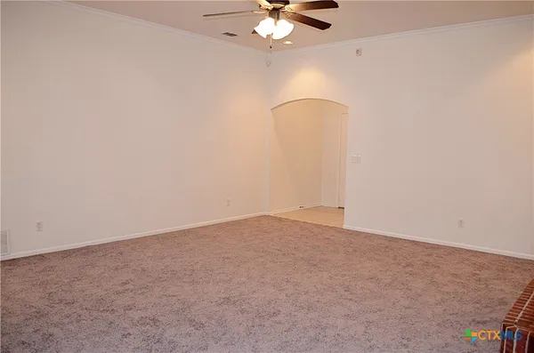 en empty room with fan and fan