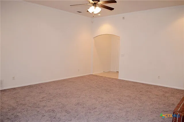 en empty room with fan and fan