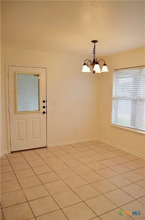 a view of an empty room and window