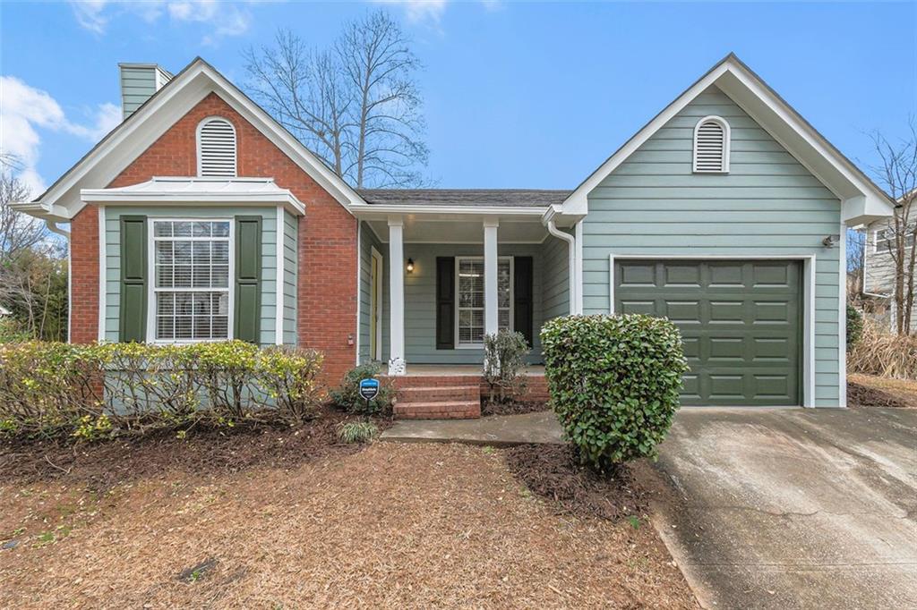 3889 Landgraf Cove Decatur, GA 30034 - Photo 1 of 1 a front view of a house with garden