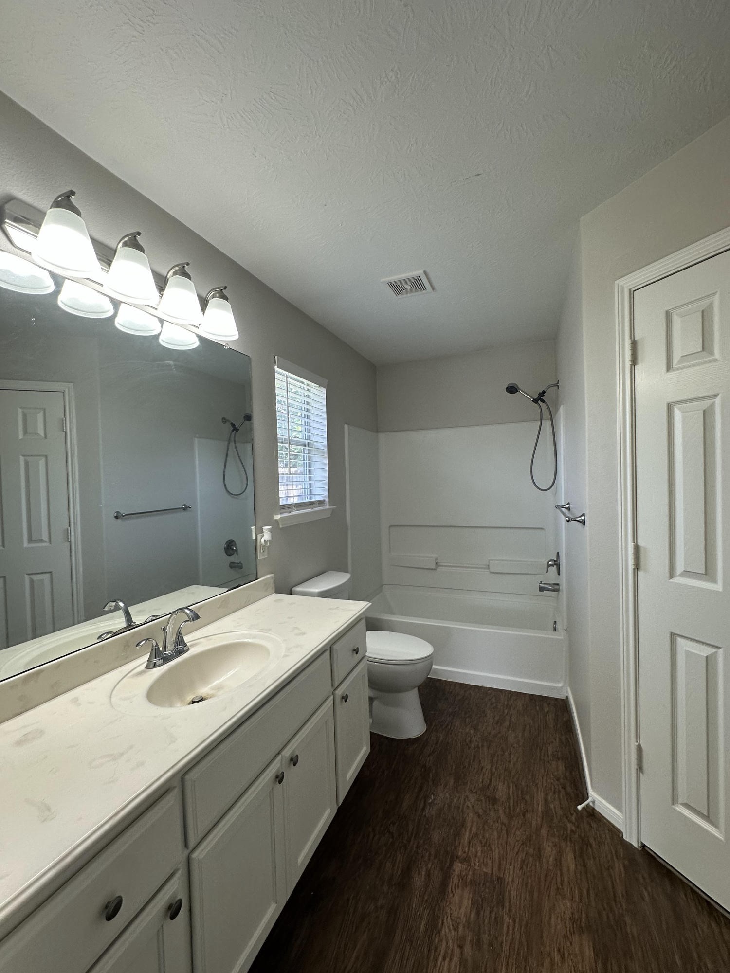 1034 Junction Court Rosenberg, TX 77471 - Photo 13 of 19 a bathroom with a sink a toilet and a mirror