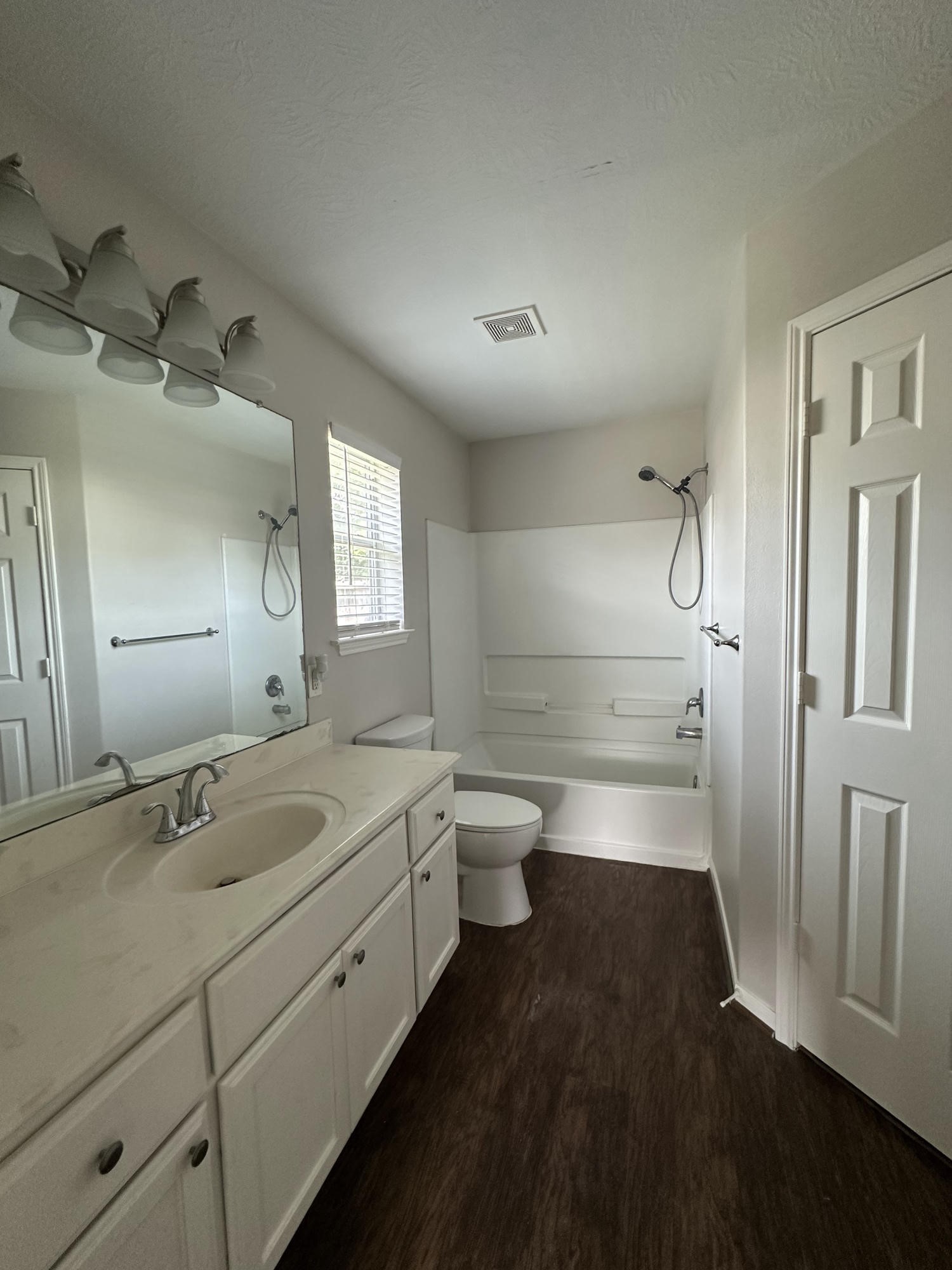 1034 Junction Court Rosenberg, TX 77471 - Photo 15 of 19 a bathroom with a double vanity sink a toilet and a shower