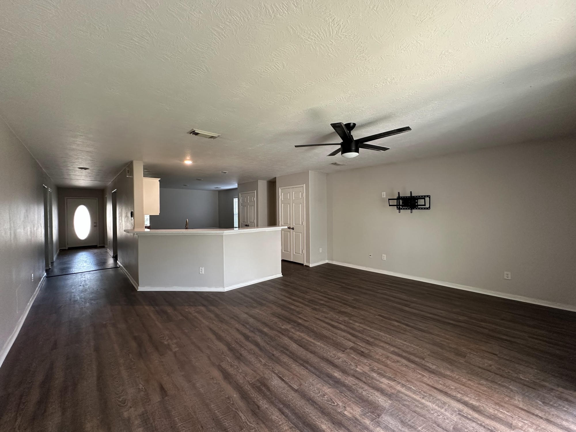 1034 Junction Court Rosenberg, TX 77471 - Photo 4 of 19 a view of a living room a kitchen and a kitchen counter tops with wooden floors