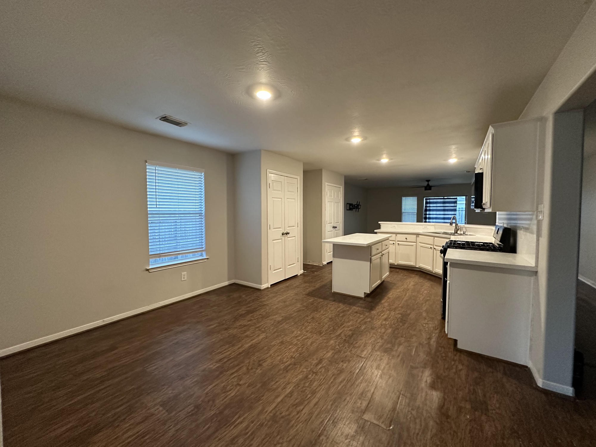 1034 Junction Court Rosenberg, TX 77471 - Photo 5 of 19 a open kitchen with white cabinets and white appliances