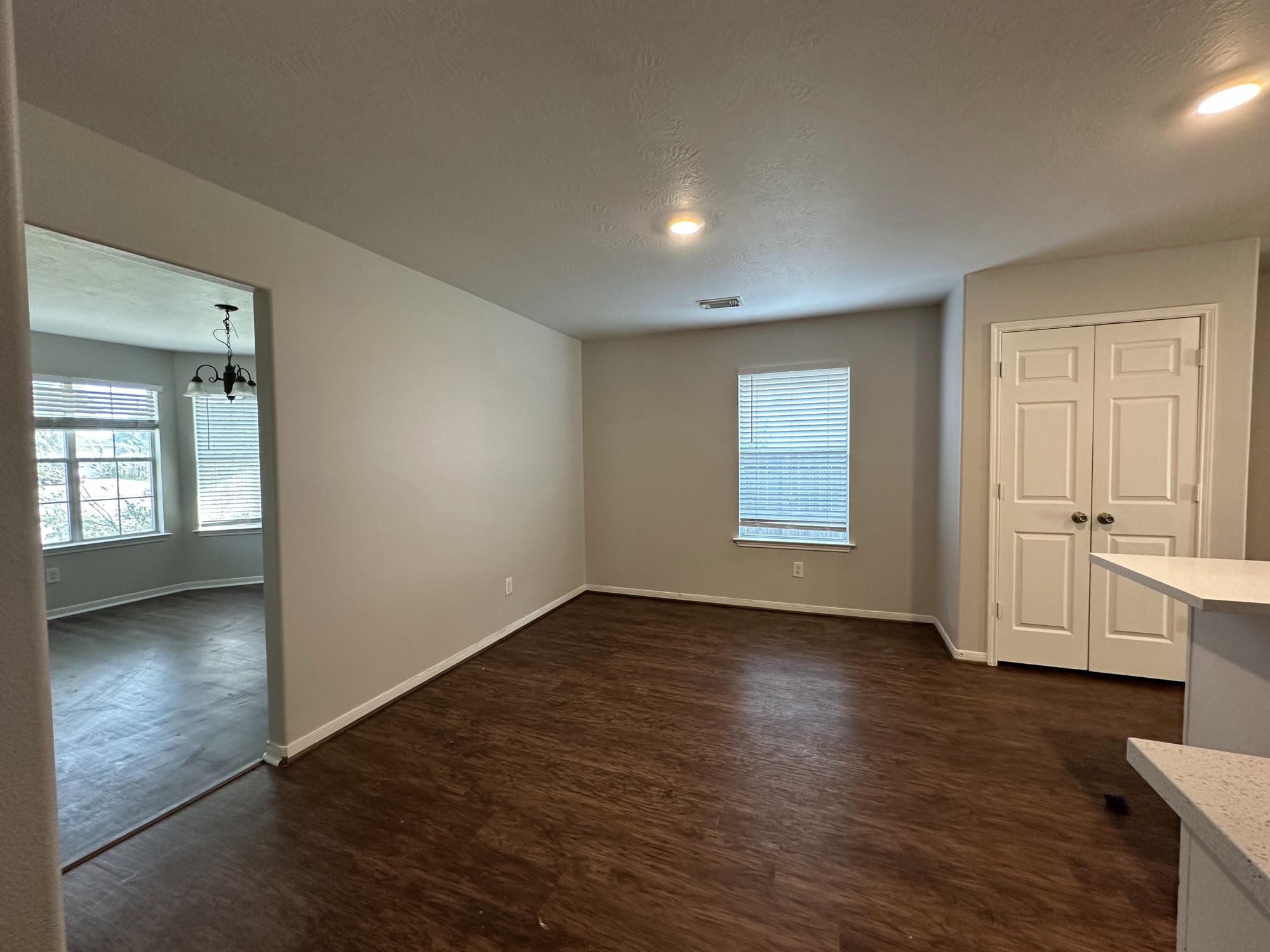 1034 Junction Court Rosenberg, TX 77471 - Photo 6 of 19 an empty room with wooden floor and windows