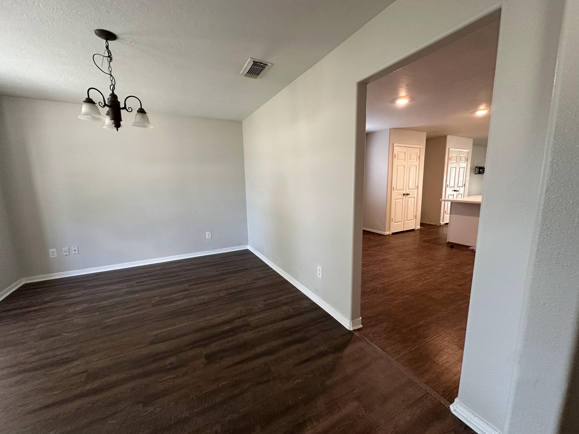 1034 Junction Court Rosenberg, TX 77471 - Photo 7 of 19 a view of a hallway with wooden floor