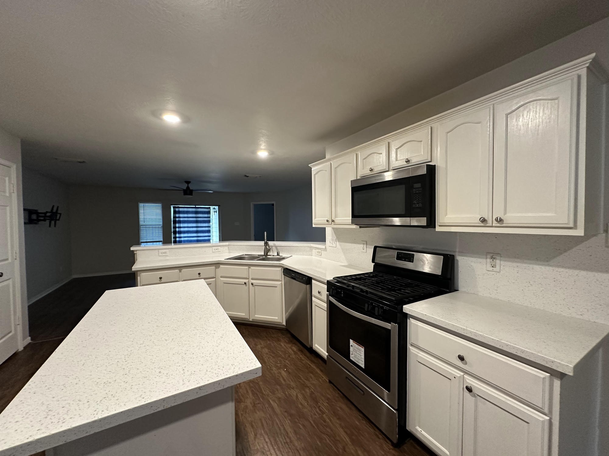 1034 Junction Court Rosenberg, TX 77471 - Photo 10 of 19 a kitchen that has a sink and a stove top oven