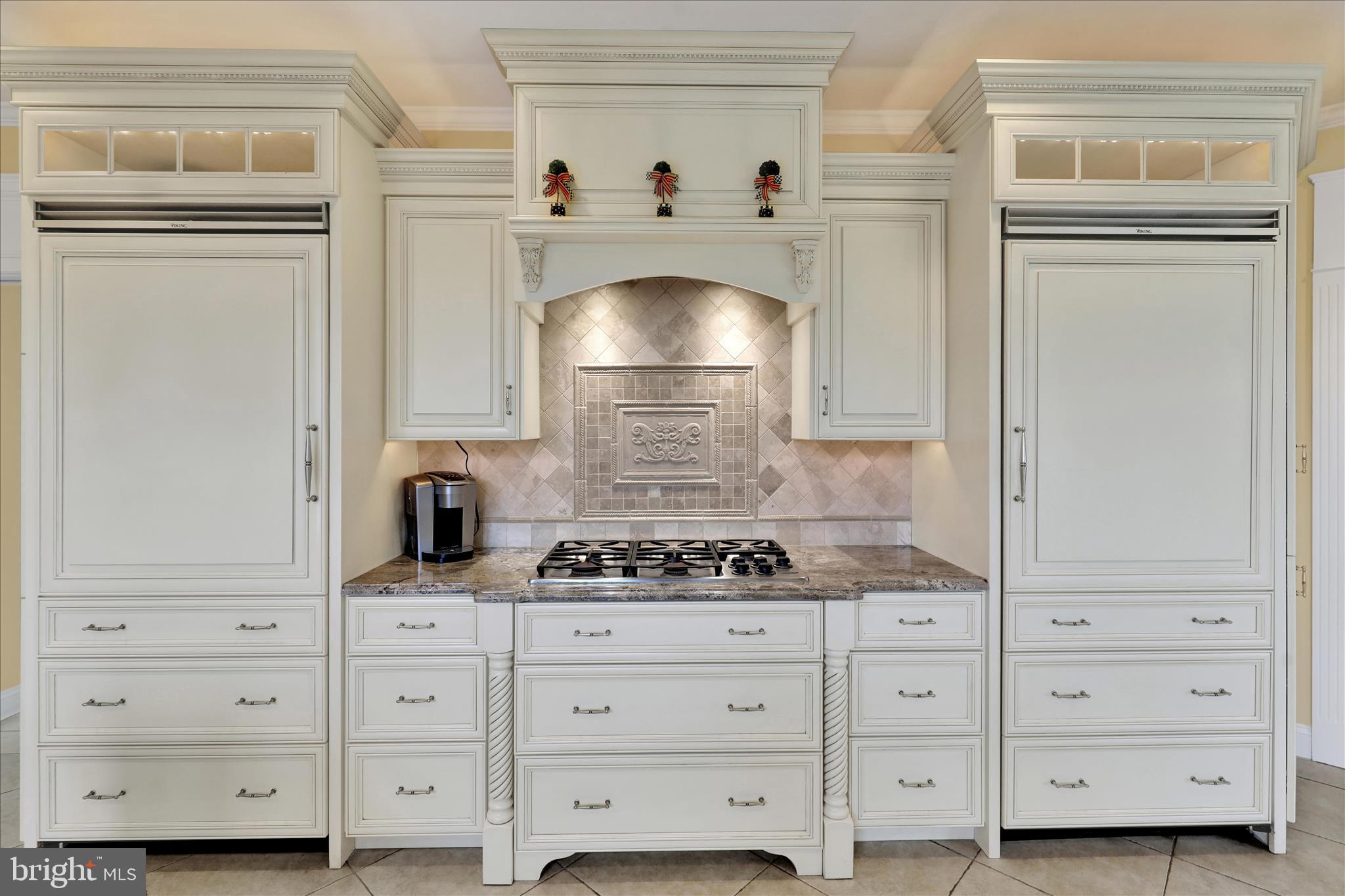 1000 Bluestone Drive Lititz, PA 17543 - Photo 45 of 132 a kitchen with white cabinets and a stove with wooden floor