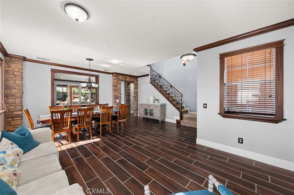 6336 Taylor Canyon Place Rancho Cucamonga, CA 91739 - Photo 11 of 60 a very nice looking room with wooden floor and furniture