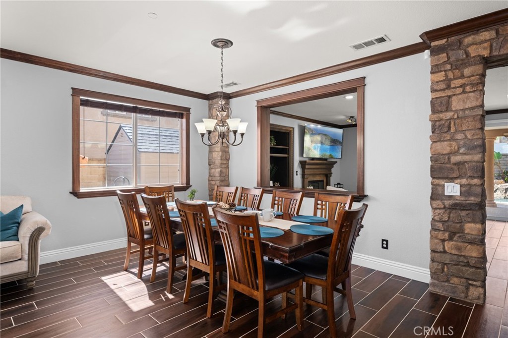 6336 Taylor Canyon Place Rancho Cucamonga, CA 91739 - Photo 12 of 60 a view of a dining room with furniture window and wooden floor
