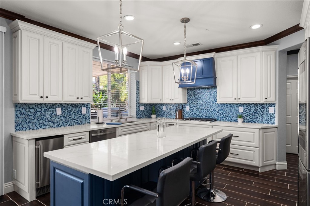 6336 Taylor Canyon Place Rancho Cucamonga, CA 91739 - Photo 17 of 60 a kitchen with a table and chairs in it
