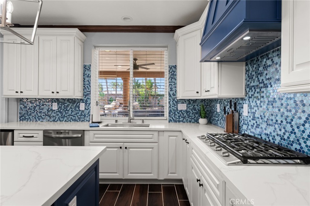 6336 Taylor Canyon Place Rancho Cucamonga, CA 91739 - Photo 18 of 60 a kitchen with white cabinets and appliances