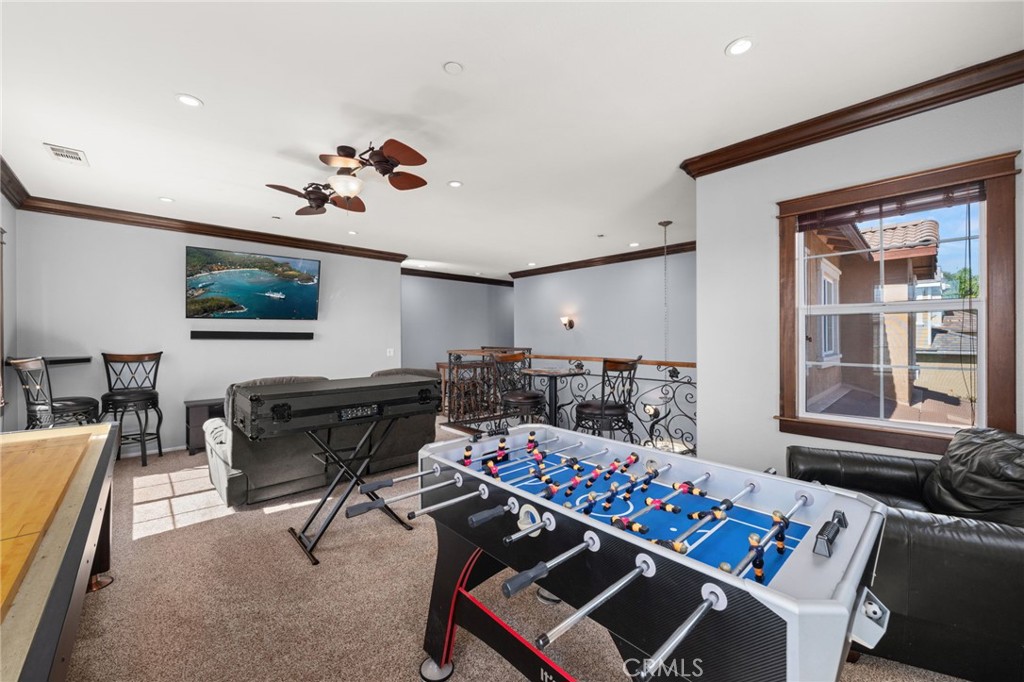 6336 Taylor Canyon Place Rancho Cucamonga, CA 91739 - Photo 29 of 60 a living room with furniture a rug and a window