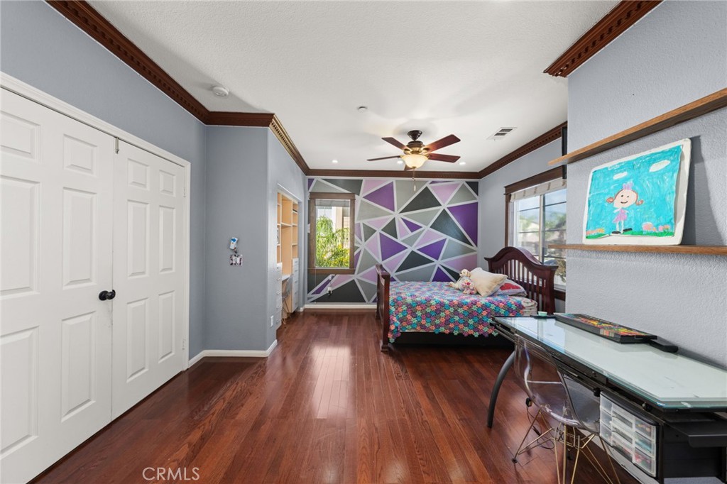 6336 Taylor Canyon Place Rancho Cucamonga, CA 91739 - Photo 36 of 60 a bedroom with furniture and a wooden floor