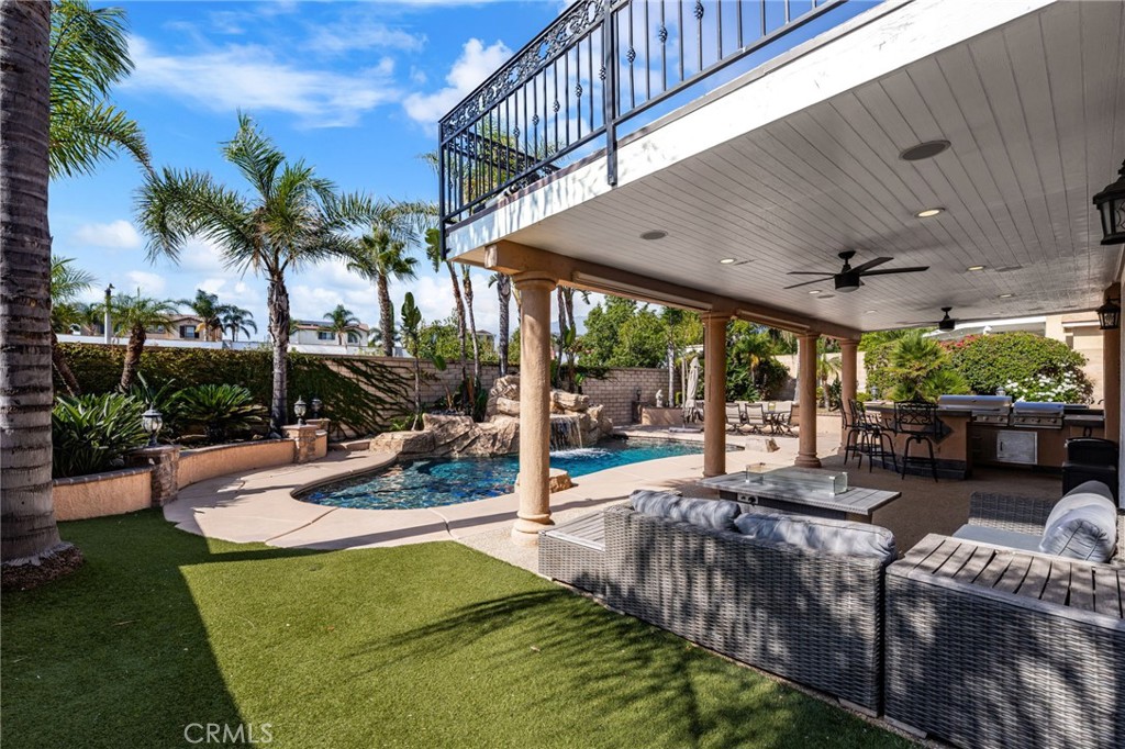 6336 Taylor Canyon Place Rancho Cucamonga, CA 91739 - Photo 45 of 60 a view of a backyard with couches chair and tables