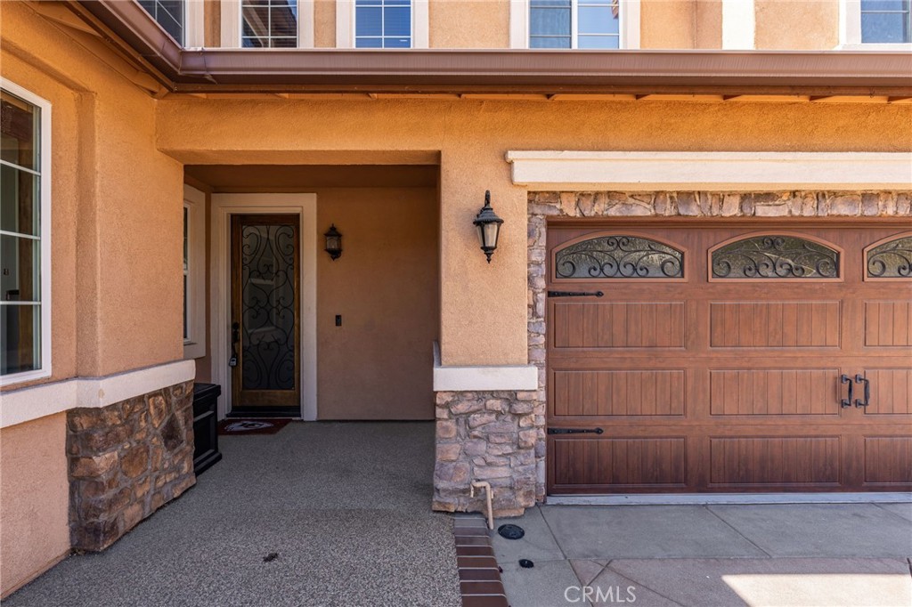 6336 Taylor Canyon Place Rancho Cucamonga, CA 91739 - Photo 7 of 60 a front view of a house with entryway