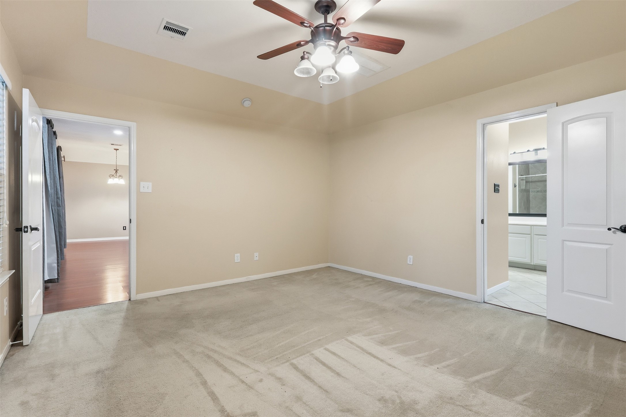 17423 Morning Star Avenue Crosby, TX 77532 - Photo 13 of 23 an empty room with chandelier fan and windows
