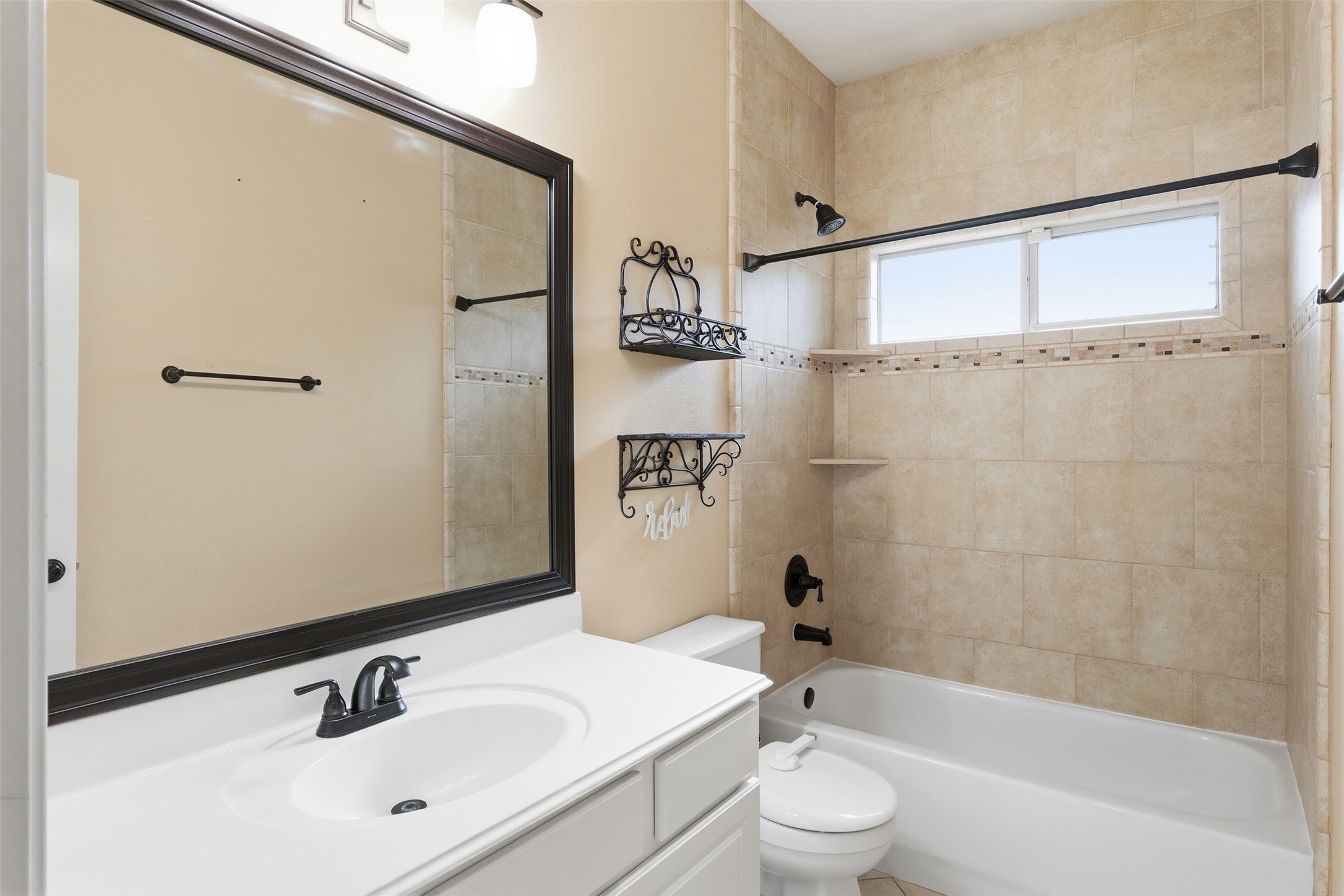 17423 Morning Star Avenue Crosby, TX 77532 - Photo 18 of 23 a bathroom with a bathtub shower sink mirror and toilet