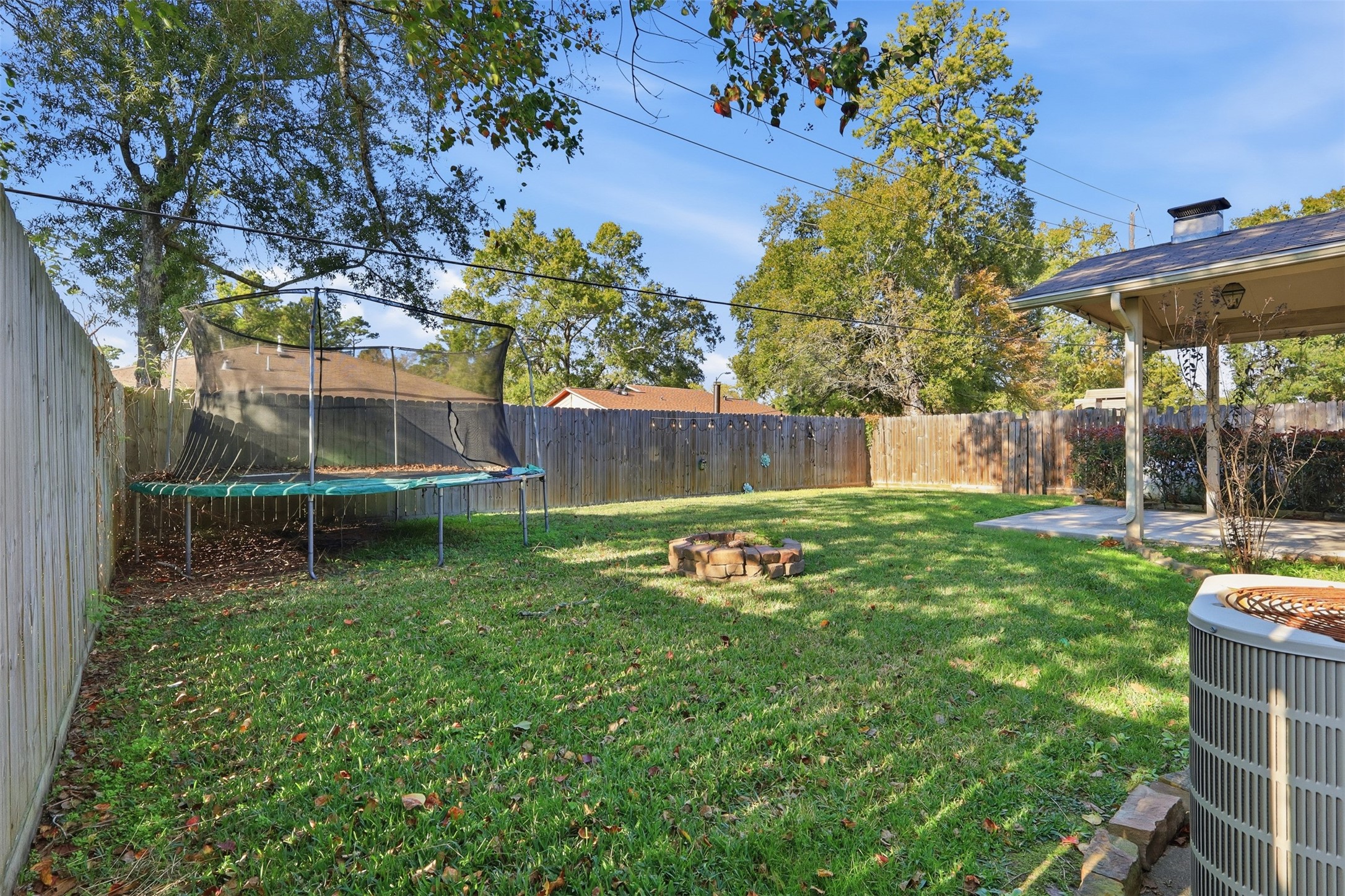 17423 Morning Star Avenue Crosby, TX 77532 - Photo 23 of 23 a view of backyard with a barn and a large tree