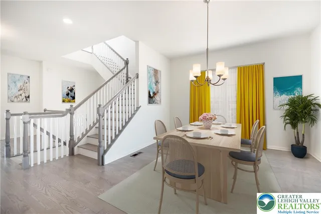 a dining room with furniture and window