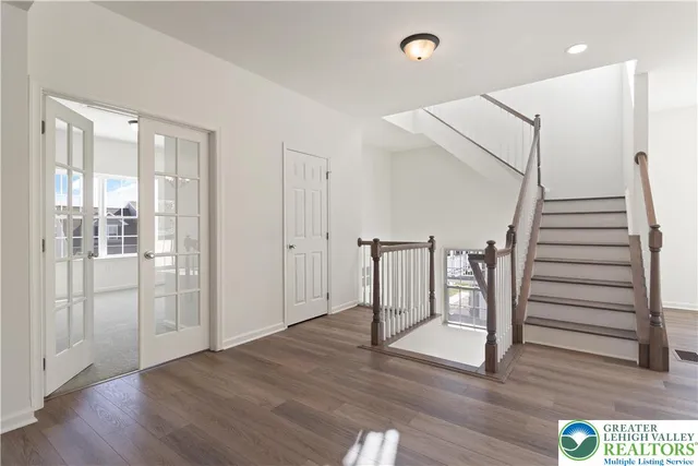 a view of entryway with wooden floor
