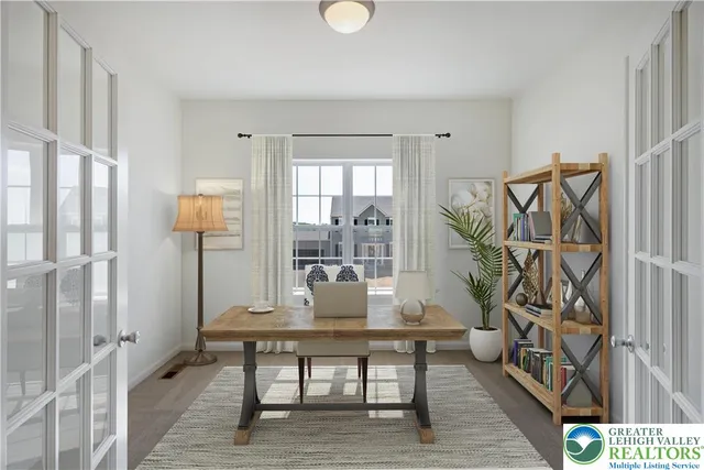a view of a livingroom with furniture and hardwood floor