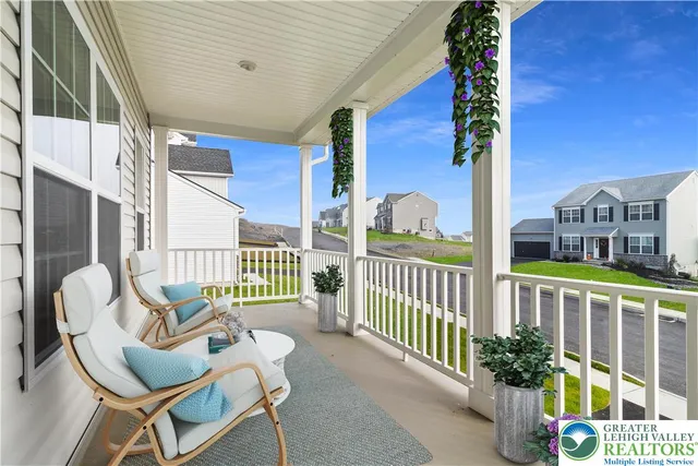 a view of a balcony with chairs