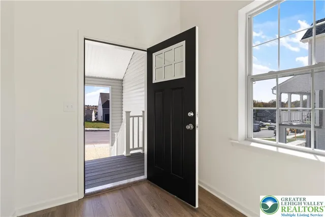 a view of front door with wooden floor