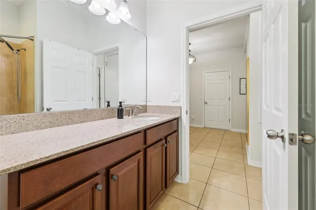 a bathroom with a sink a vanity and a mirror