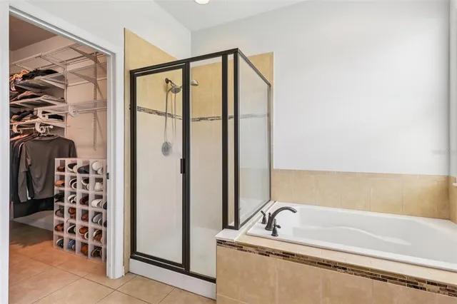 a bathroom with a bathtub and a shower