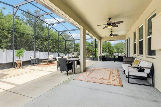 a view of a chairs and table in the patio