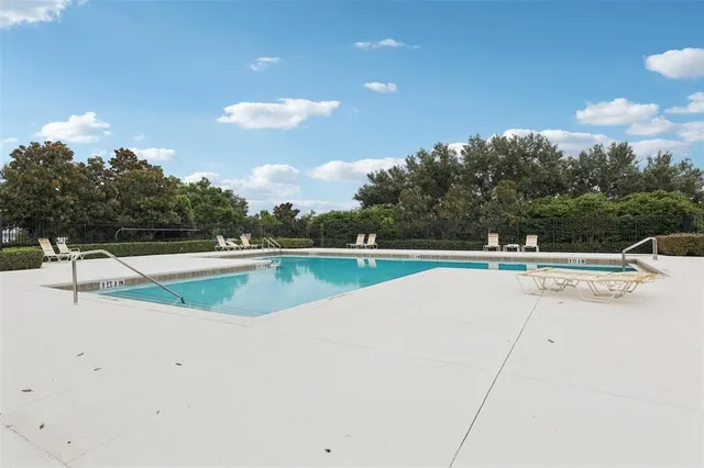 a view of a swimming pool with a patio