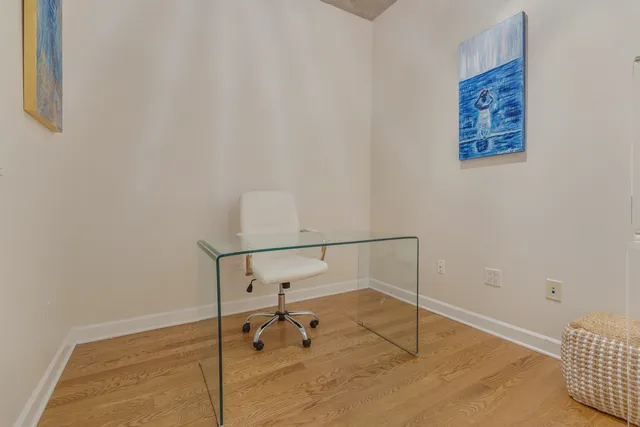 a room with a desk and painted walls