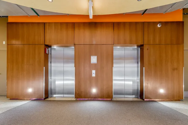 a view of an empty room with closet