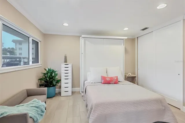 a bedroom with a bed and window