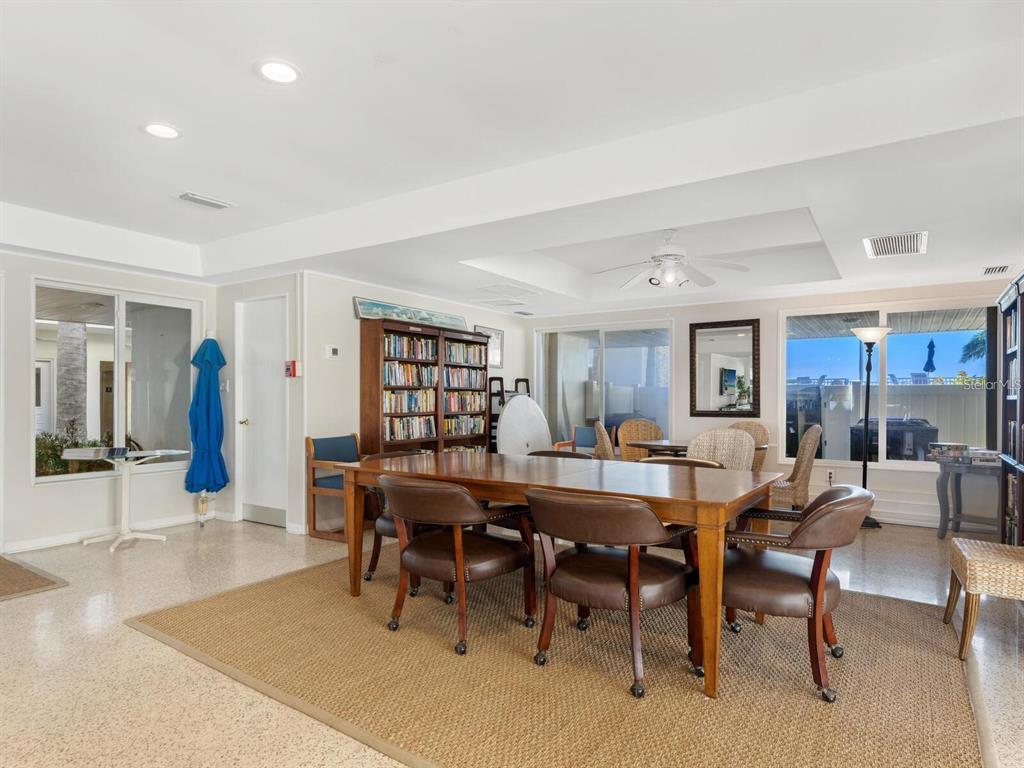 1900 Benjamin Franklin Drive, Unit V15 Sarasota, FL 34236 - Photo 34 of 39 a view of a dining room with furniture