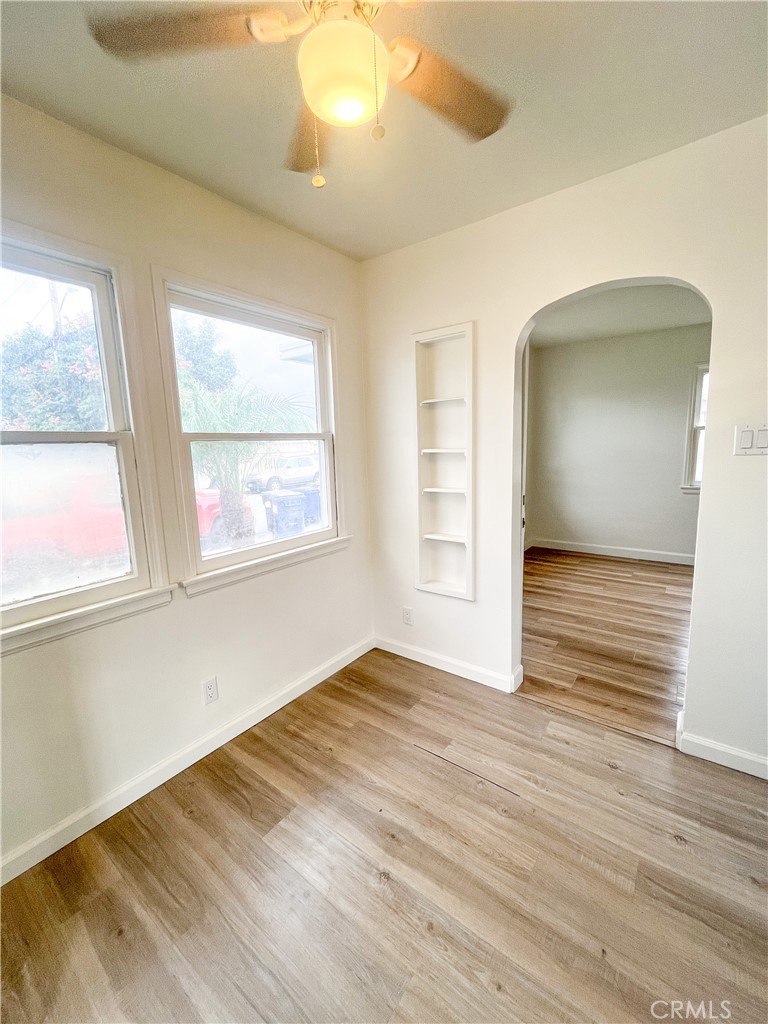 4512 Linsley Street Compton, CA 90221 - Photo 2 of 8 a view of an empty room with wooden floor and a window