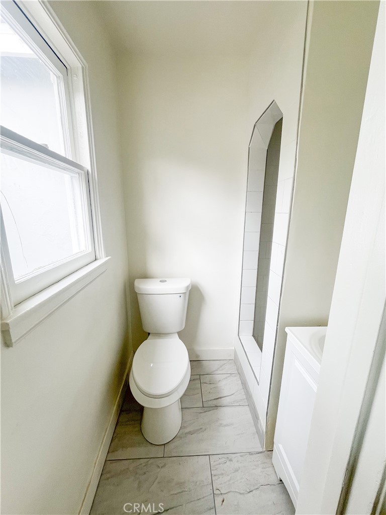 4512 Linsley Street Compton, CA 90221 - Photo 8 of 8 a bathroom with a toilet and a shower