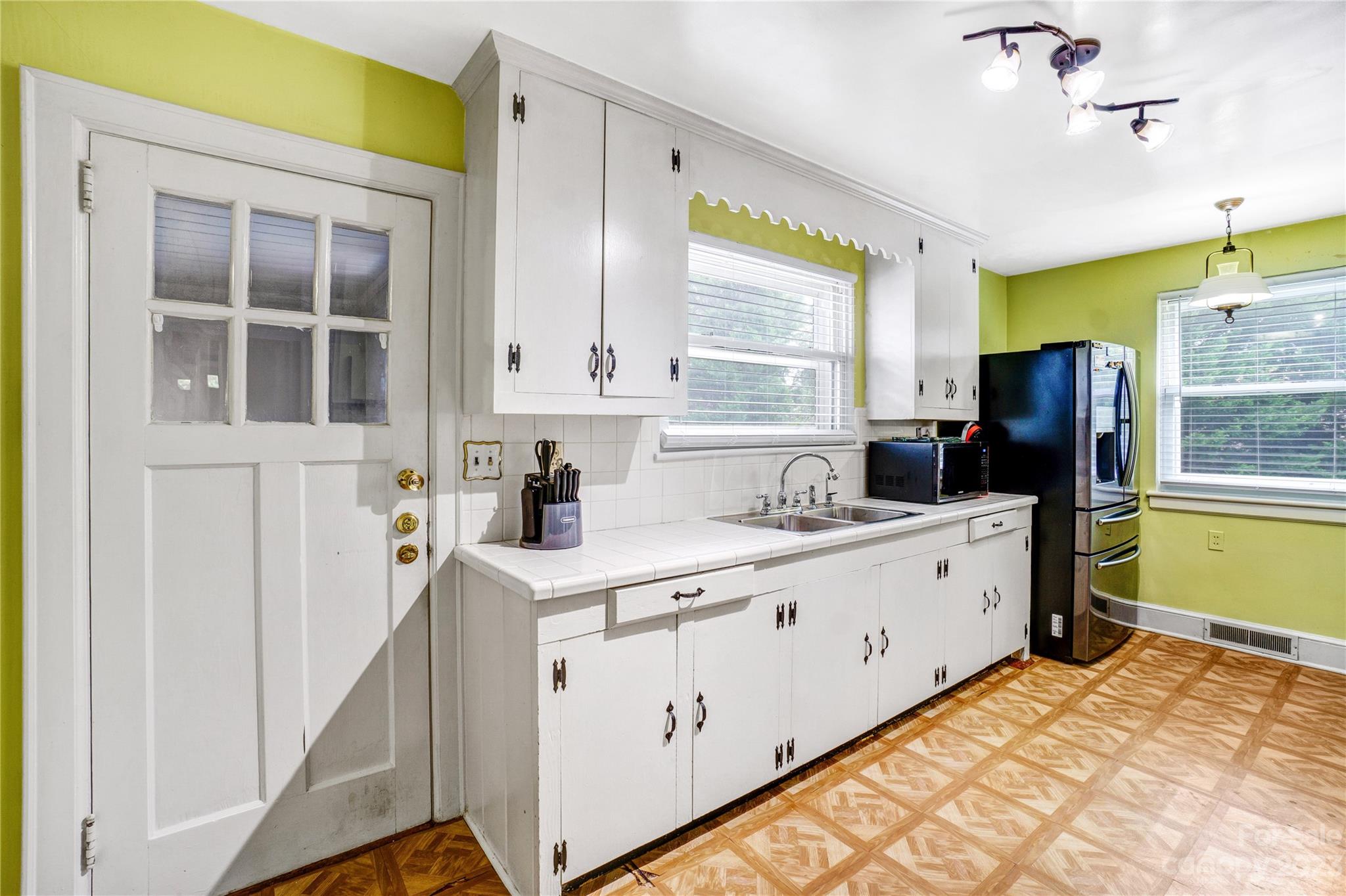 6512 Tuckaseegee Road Charlotte, NC 28214 - Photo 15 of 47 a kitchen with sink cabinets and window
