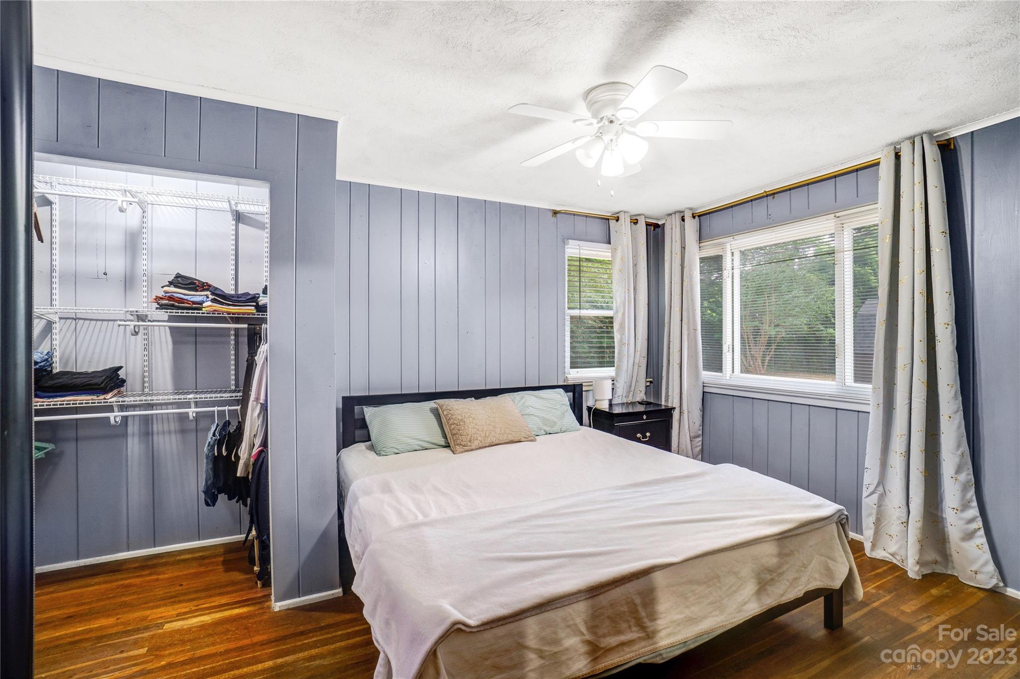 6512 Tuckaseegee Road Charlotte, NC 28214 - Photo 16 of 47 a bedroom with a bed and a chandelier