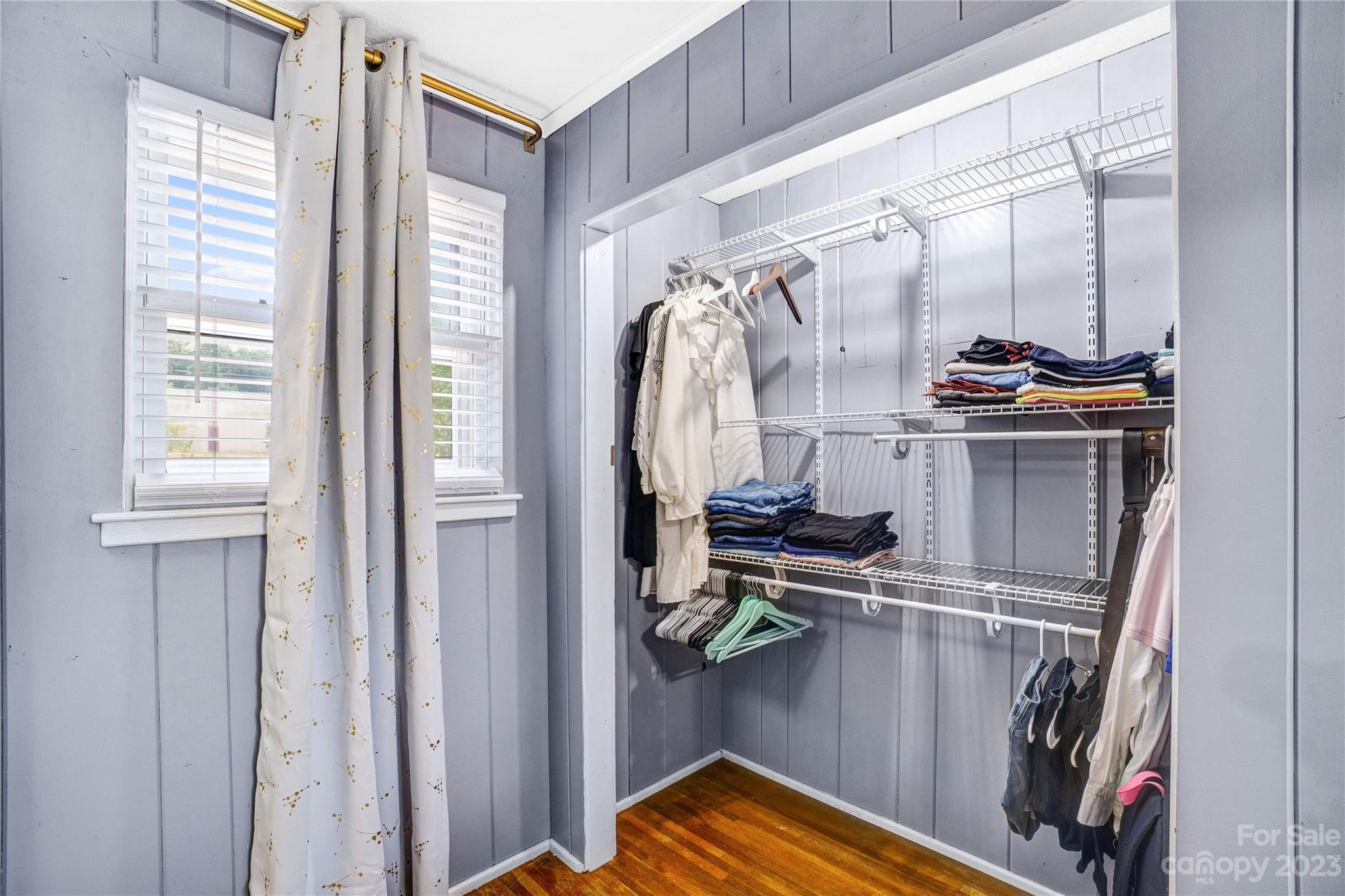 6512 Tuckaseegee Road Charlotte, NC 28214 - Photo 18 of 47 a view of walk in closet with clothes and shoes