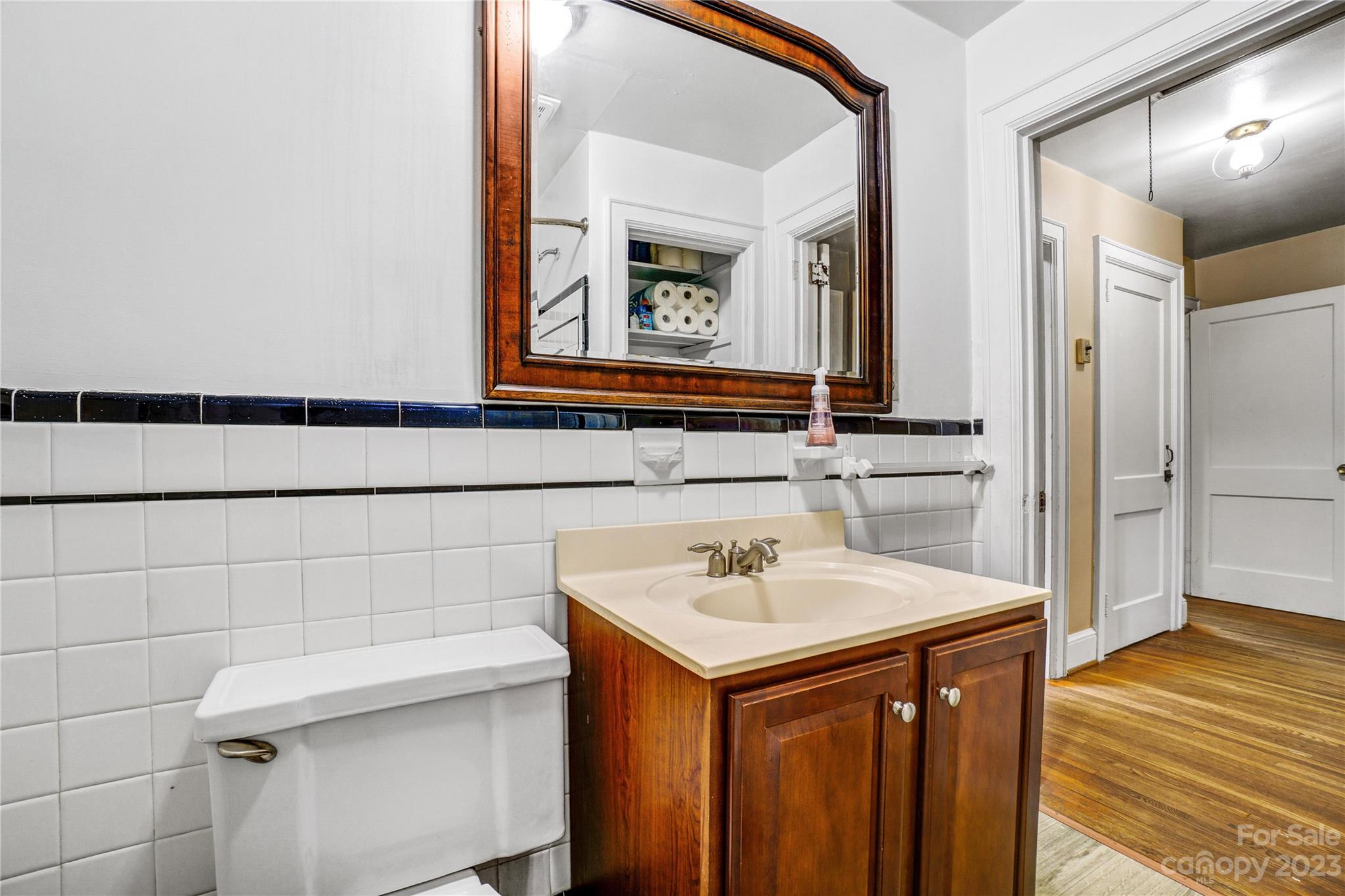 6512 Tuckaseegee Road Charlotte, NC 28214 - Photo 25 of 47 a bathroom with a sink and a mirror