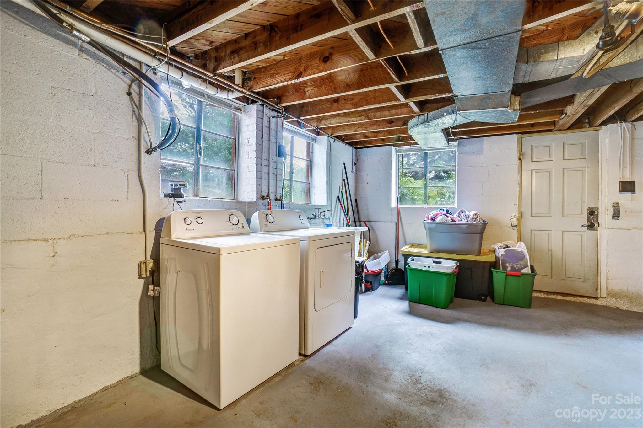 6512 Tuckaseegee Road Charlotte, NC 28214 - Photo 29 of 47 a utility room with dryer and washer