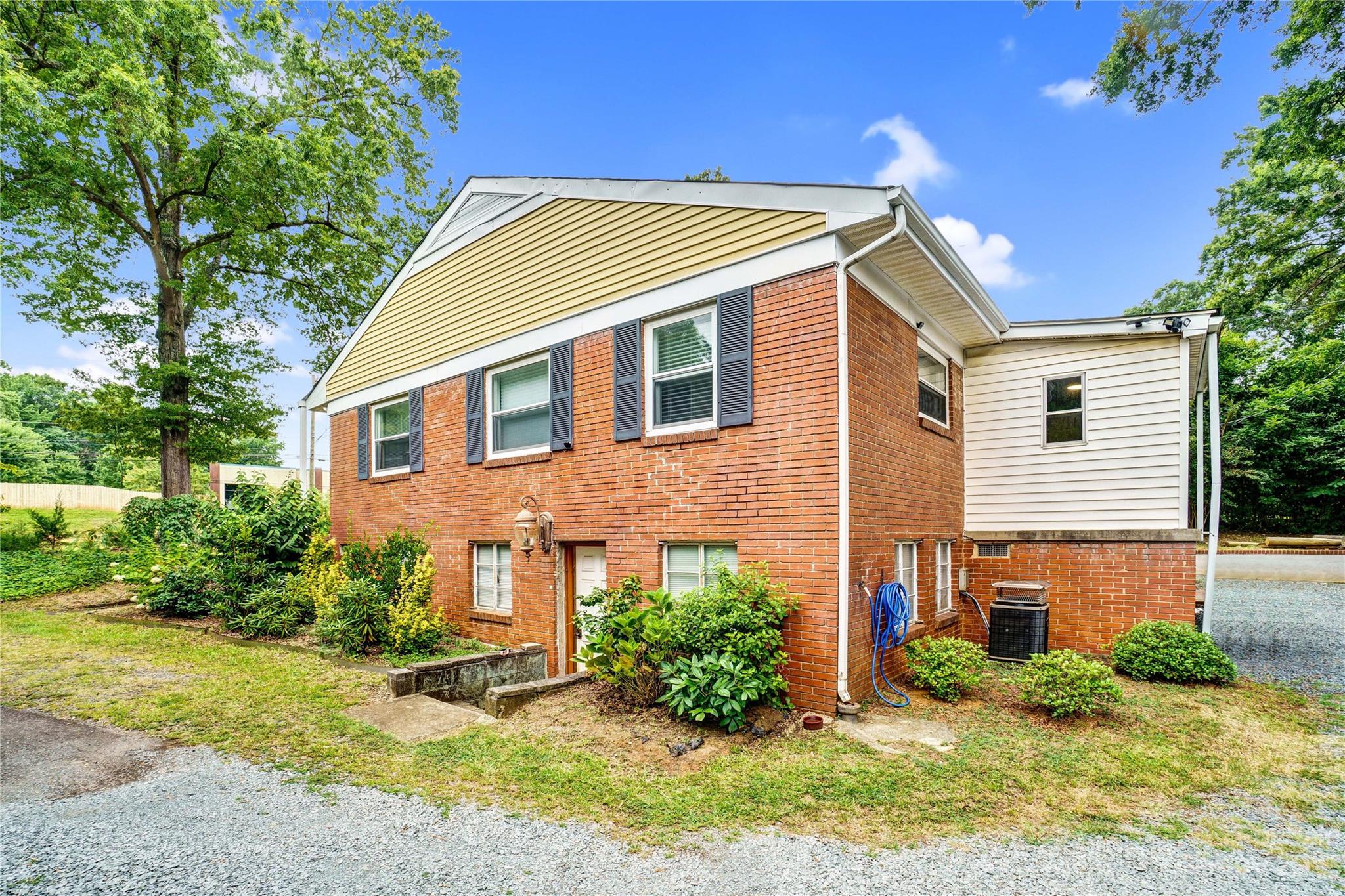 6512 Tuckaseegee Road Charlotte, NC 28214 - Photo 38 of 47 a view of a house with a yard