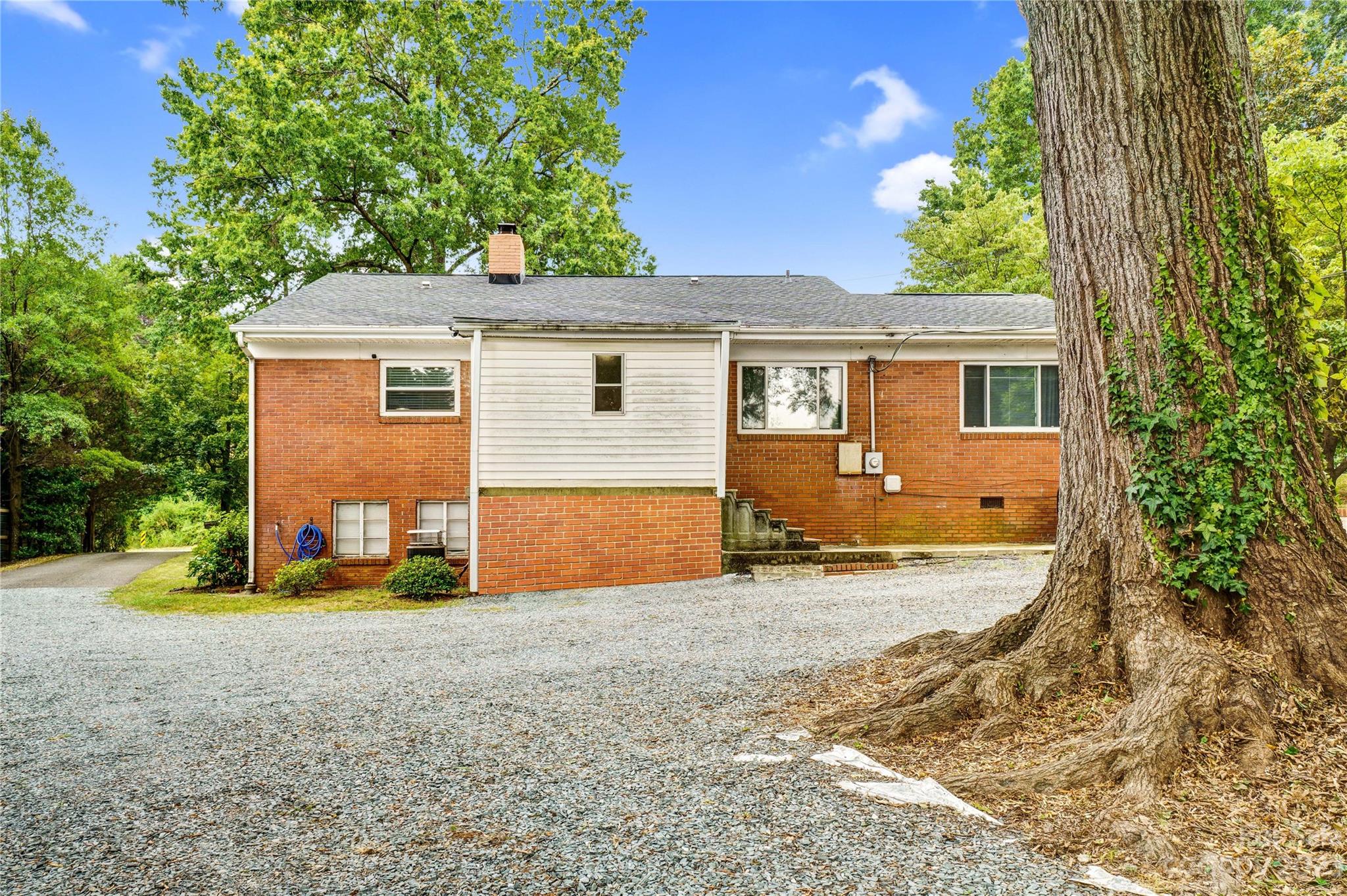6512 Tuckaseegee Road Charlotte, NC 28214 - Photo 40 of 47 front view of a house with a patio