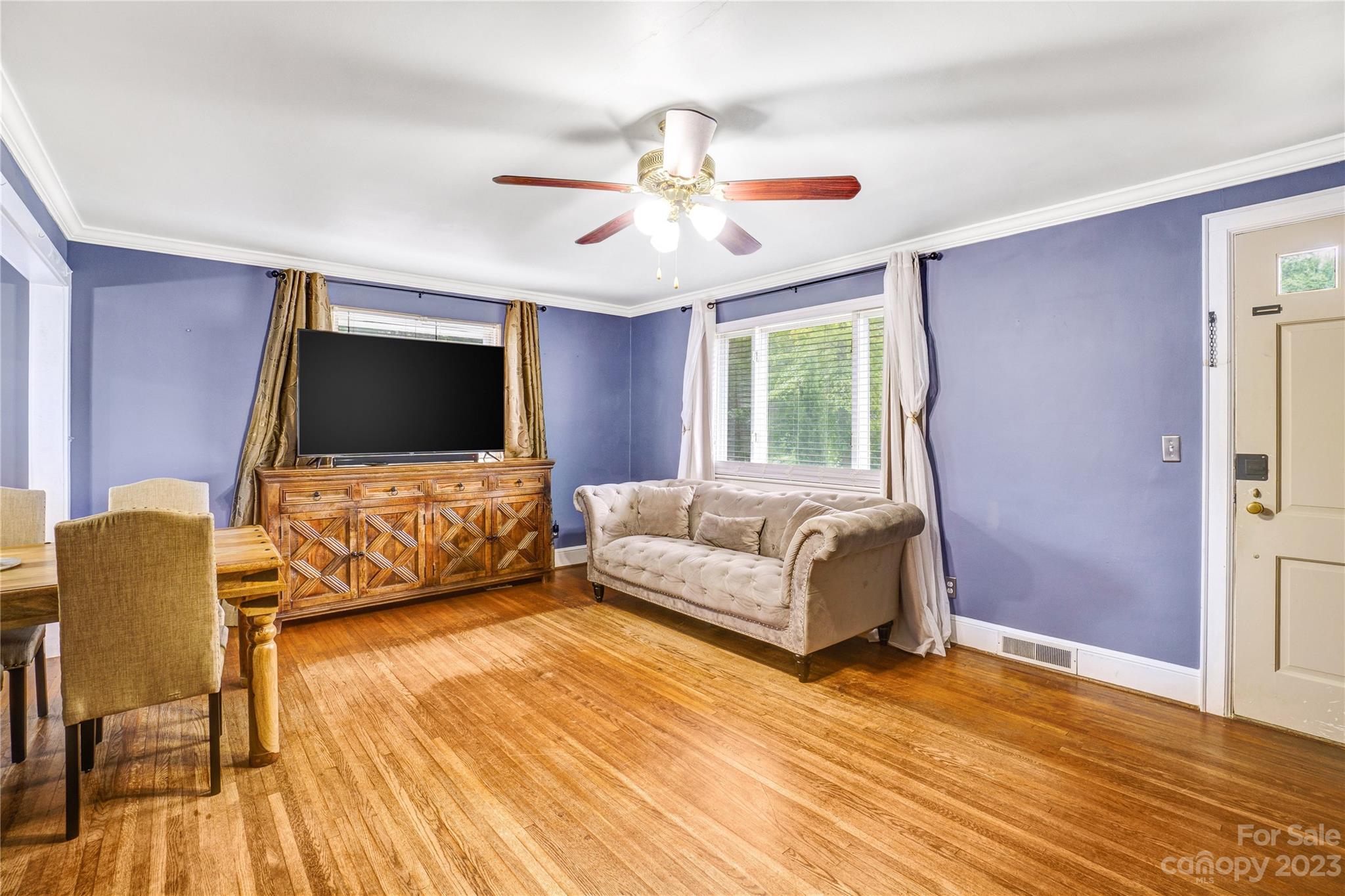 6512 Tuckaseegee Road Charlotte, NC 28214 - Photo 6 of 47 a living room with furniture and a flat screen tv