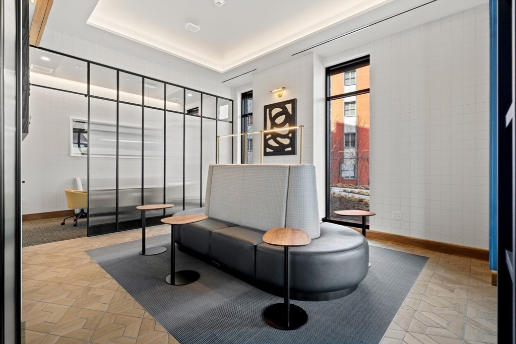 1515 Commonwealth Avenue, Unit 504 Boston, MA 02135 - Photo 20 of 41 a living room with furniture and a large window