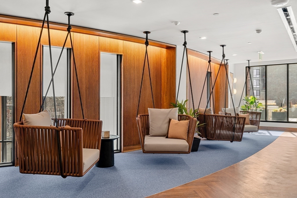 1515 Commonwealth Avenue, Unit 504 Boston, MA 02135 - Photo 27 of 41 a living room with furniture and large window