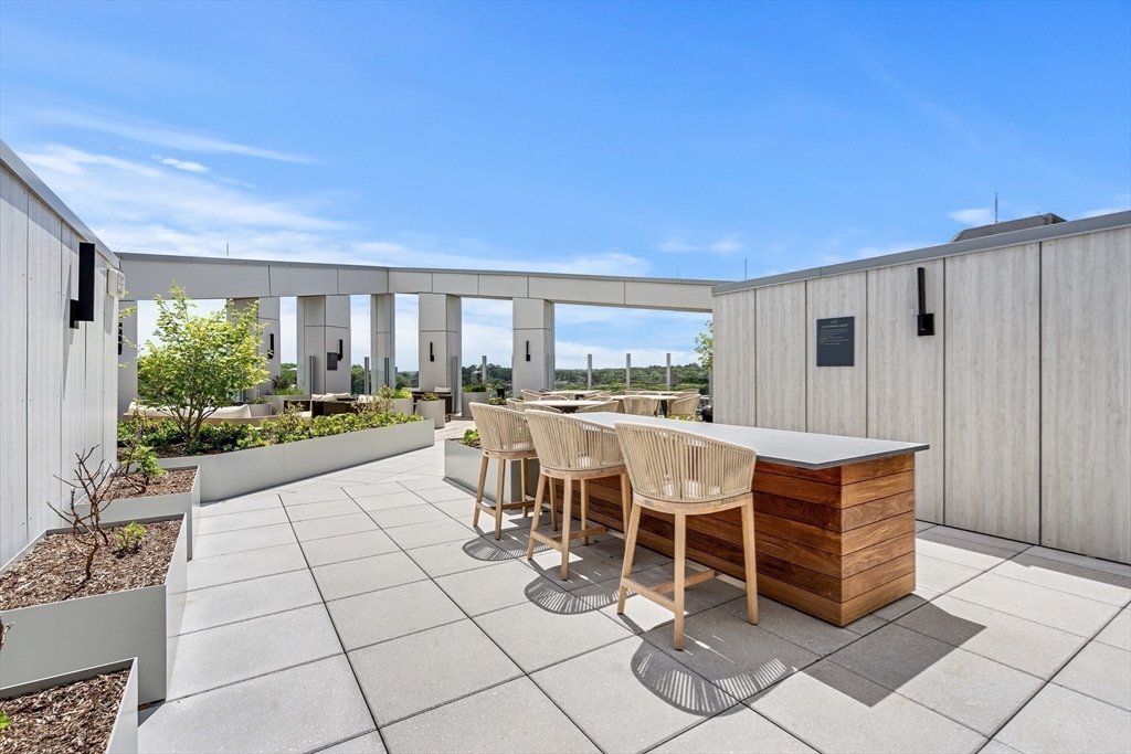 1515 Commonwealth Avenue, Unit 504 Boston, MA 02135 - Photo 36 of 41 a dinning table and chairs in the room